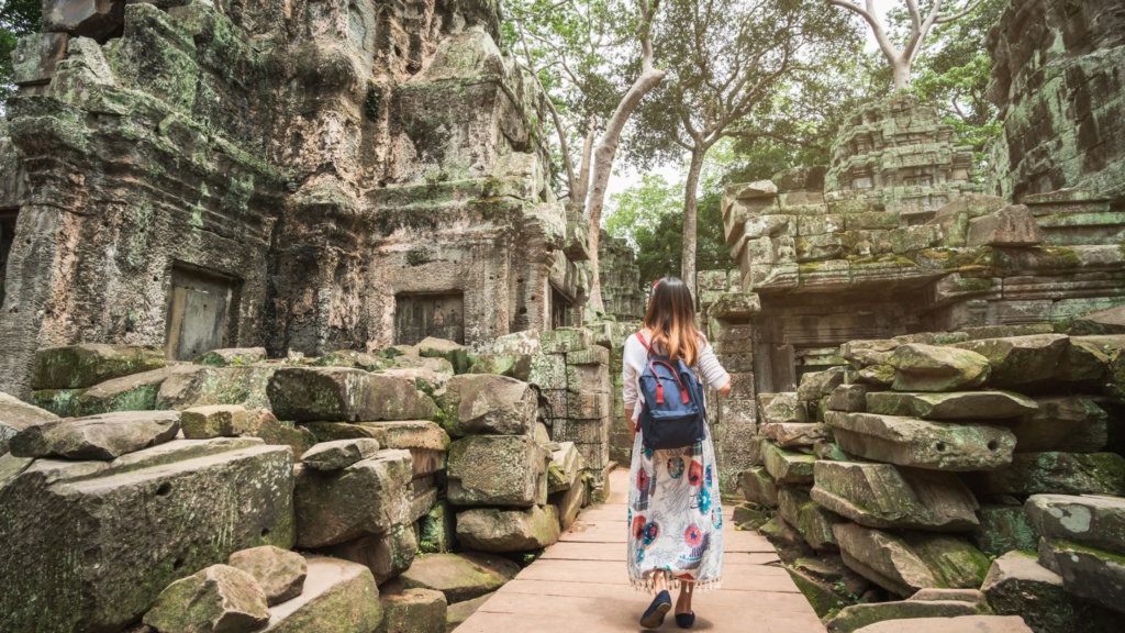 A traveler exploring Ta Phrom Temple in Angkor Wat
