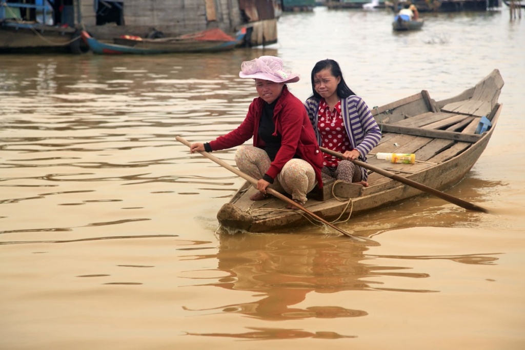 Tonle sap lake on boat with villagers